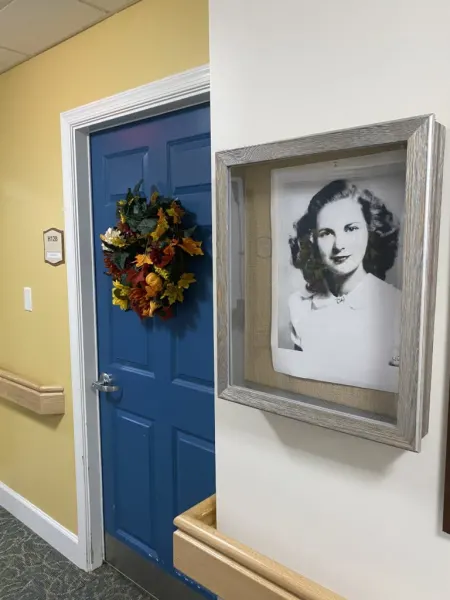 Framed black and white photo in a hallway